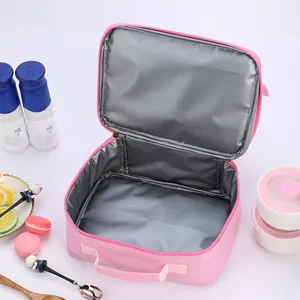 Close-up of pink lunch bag showing thick silver aluminum foil lining for insulation