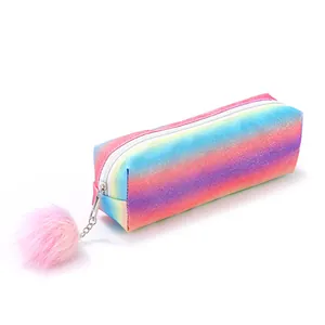 Detailed close-up of rainbow glitter pencil case with pink pompom and silver zipper