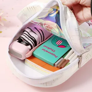 Detail view of unicorn backpack showing spacious storage for umbrella and stationery