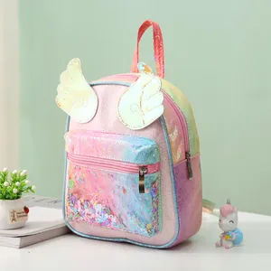 Detail of colorful rainbow laser backpack with shiny sequins and golden angel wings