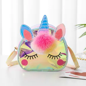 Close-up of holographic unicorn crossbody bag with colorful pom-pom and adjustable strap