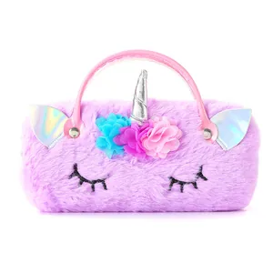 Detail of plush purple unicorn bag featuring iridescent horn and colorful chiffon flowers