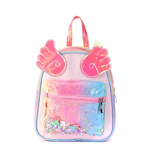Close-up of pink sequin kids backpack with rainbow laser wings and glitter pocket