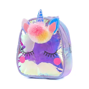 Detail of holographic unicorn backpack featuring 3D ears and colorful pom-pom decor