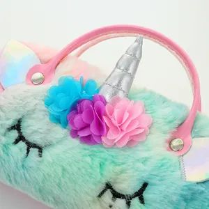 Close-up of plush unicorn handbag showing soft faux fur and metallic silver horn detail