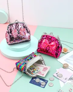Detailed shot of sequined crossbody bags with bow accents and retro metal clasps