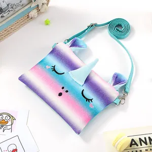 Detail of sequined rainbow unicorn plush bag with embroidery and adjustable strap