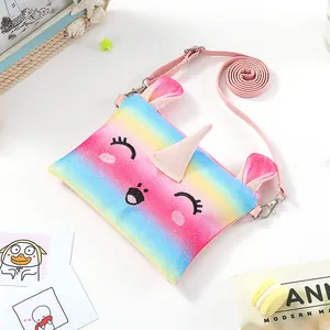 Detailed macro of a glittery rainbow unicorn crossbody plush purse for kids
