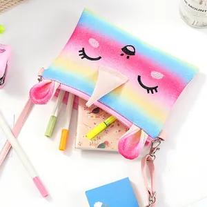 Rainbow glitter unicorn crossbody bag for girls showing storage capacity for small items