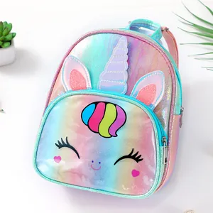 Detail view of the iridescent laser unicorn backpack with 3D ears and colorful unicorn horn