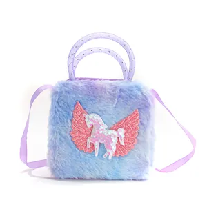Detail of colorful plush unicorn bag showing purple handles and pink sequin Pegasus patch