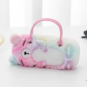 Detail of soft plush rainbow bear pouch featuring cartoon embroidery and pink top handle