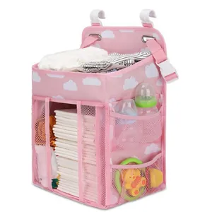Pink hanging diaper organizer for crib with cloud patterns and large storage capacity