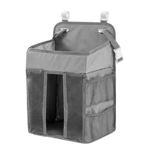 Detail of grey baby diaper organizer with mesh pockets and adjustable hanging straps