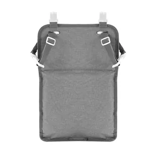 Close-up of grey nursery organizer with white plastic hooks and adjustable buckle straps