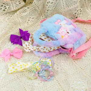 Detailed set of plush rainbow unicorn handbag with matching hair bows and accessories