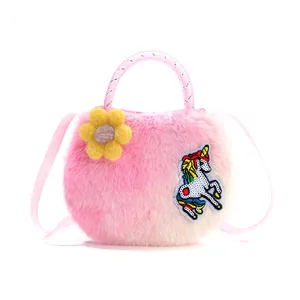 Detail of plush rainbow unicorn bag featuring floral accent and sequined embroidery