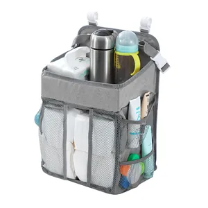 Detail view of baby nursery organizer with diapers and bottles on white background
