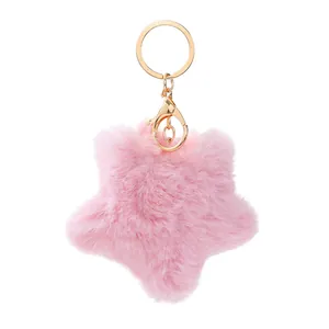 Plüschiger rosa Stern Schlüsselanhänger mit weichem Kunstfell und goldenem Verschluss