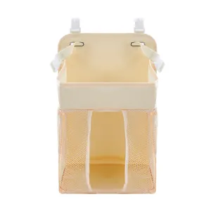 Detail of hanging baby diaper organizer with hooks and breathable mesh storage