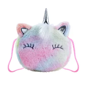 Detail of plush rainbow unicorn shoulder bag showing sequin ears and silver horn