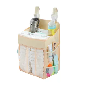 Large capacity beige baby crib organizer with compartments for diapers and bottles