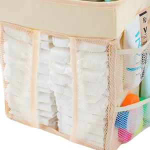 Detail view of beige diaper organizer showing mesh pockets and spacious storage sections