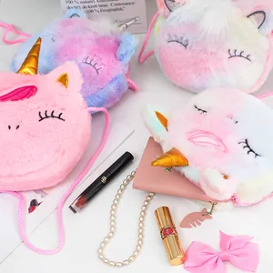 Detailed view of colorful plush unicorn bags with soft faux fur and golden horns