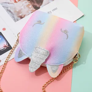Close-up of glitter unicorn crossbody bag with gradient rainbow colors and gold chain