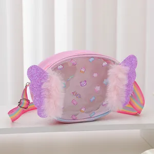 Close-up of heart kids bag featuring glitter purple wings and rainbow stripe strap