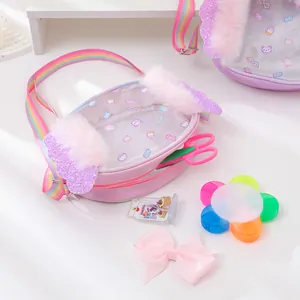 Detail of pink children's bag featuring rainbow straps, plush trim, and glittery wings