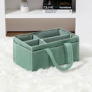Green fleece diaper caddy organizer with four sections and side handles for home storage