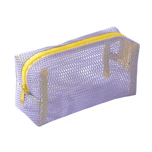 Close-up of purple mesh pencil case with yellow zipper showing nylon honeycomb texture