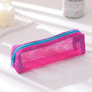 Close-up of pink mesh pencil case with blue zipper on a white aesthetic display tray