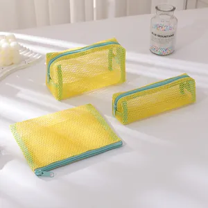 3-piece set of yellow mesh organizer bags with blue zippers for stationery and cosmetics