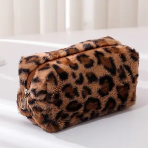 Close-up of leopard print plush bag showing soft faux fur texture and metal zipper