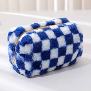 Detail of blue and white checkered plush pencil case with soft faux fur texture and gold zipper