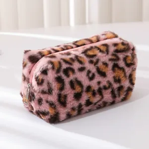 Close-up of pink leopard print plush pencil case featuring soft faux fur and metal zipper