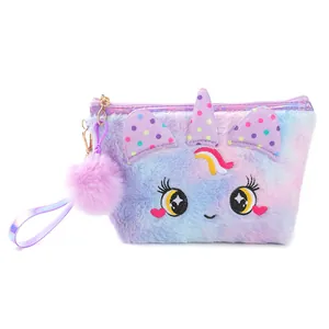 Detail of plush unicorn cosmetic bag with rainbow fur, sequins, and fluffy ball charm