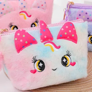 Detail of plush cartoon makeup bag with colorful gradient fur and cute embroidery