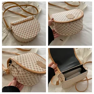 Detailed views of vintage monogram saddle bag with adjustable strap and internal storage