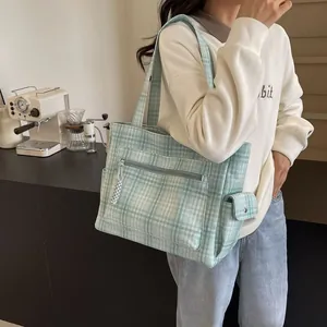 Green and cream plaid tote bag with multiple pockets and large capacity for casual use