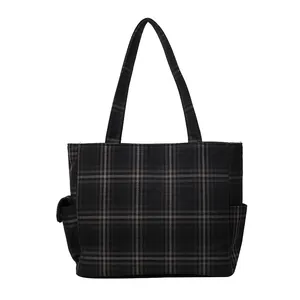 Minimalist dark grey plaid tote bag with side pockets and spacious interior design