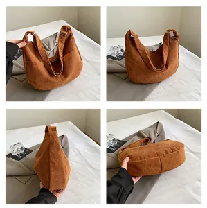 Detailed views of caramel corduroy crescent bag showing texture, shape and side tag
