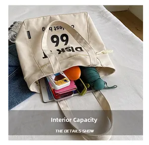 Large capacity canvas tote bag showing interior space for tablet and daily essentials