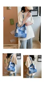 Detail view of denim patchwork tote bag with raw edge seams and blue fabric squares