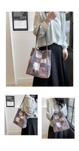 Detailed view of checkered patchwork tote bag showing fabric texture and long shoulder strap
