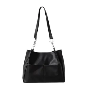 Minimalist black faux leather tote bag with stylish silver metal chain straps on white background