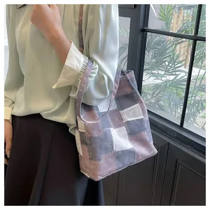 Detail of multi-color patchwork canvas tote bag showing its large capacity and strap