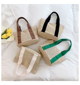 Top view of woven straw tote bags with colorful handles and summer tulip accents